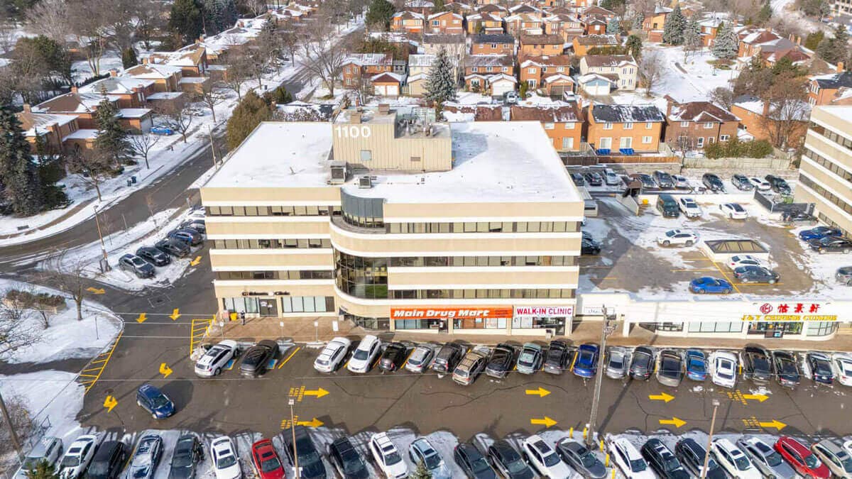 Building aerial view with parking