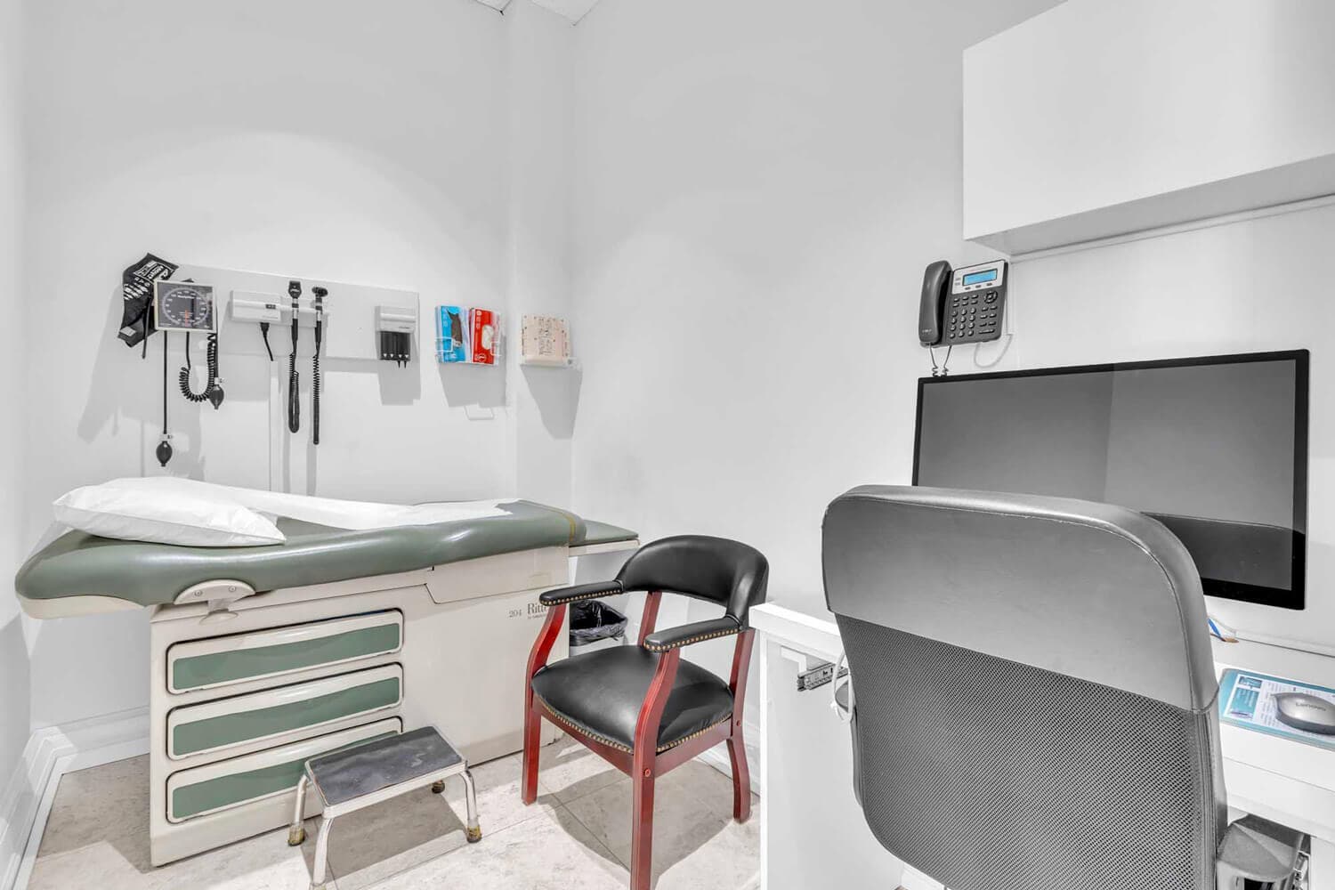 Exam room with blood pressure monitor